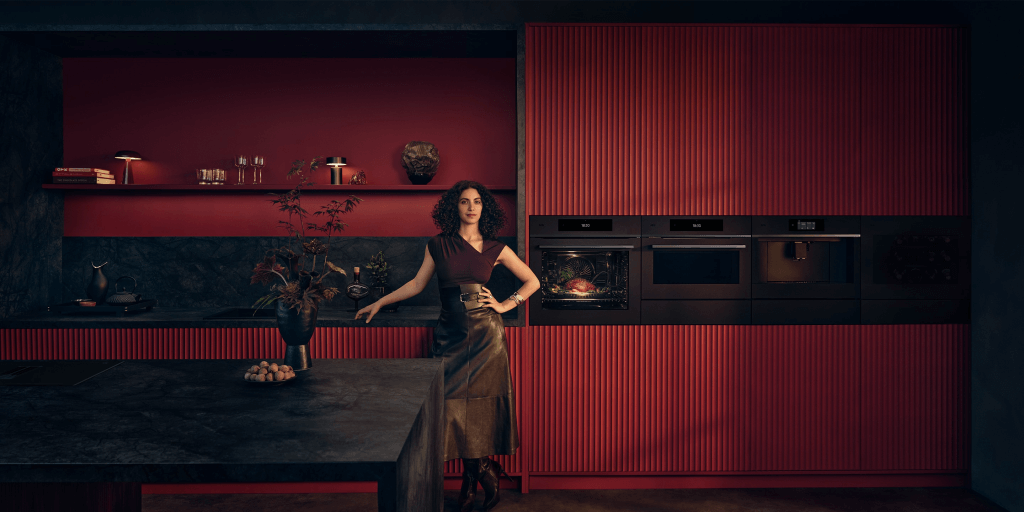 A girl standing inthe kitchen