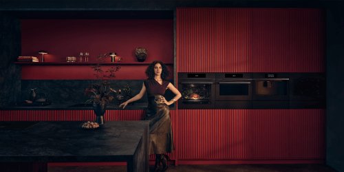 A girl standing inthe kitchen