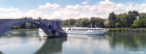 CroisiEurope river cruise ship sailing through a scenic European destination
