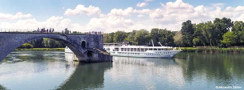 CroisiEurope river cruise ship sailing through a scenic European destination
