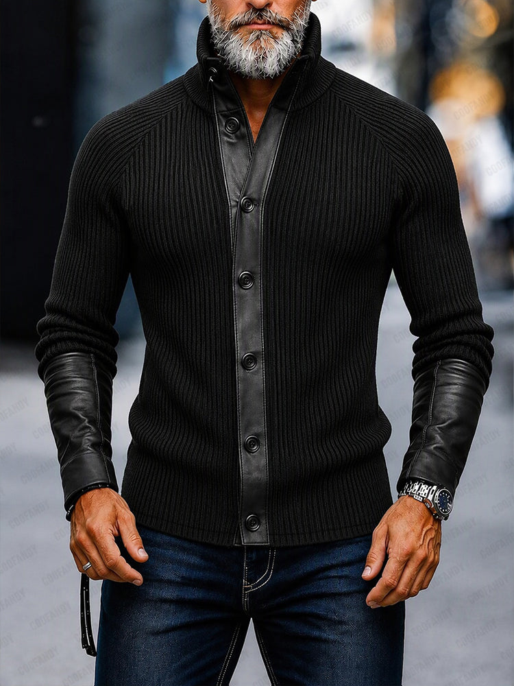 Man wearing a black knitted cardigan with stand-up collar and leather-look trim