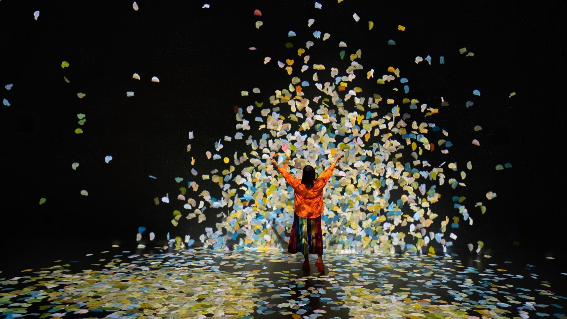 Colour in Motion gallery with swirling projected colours at Frameless