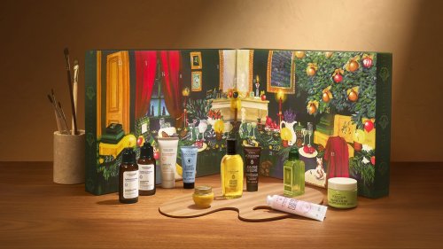 L'Occitane 2026 Classic Advent Calendar open on a wooden table with miniature beauty products