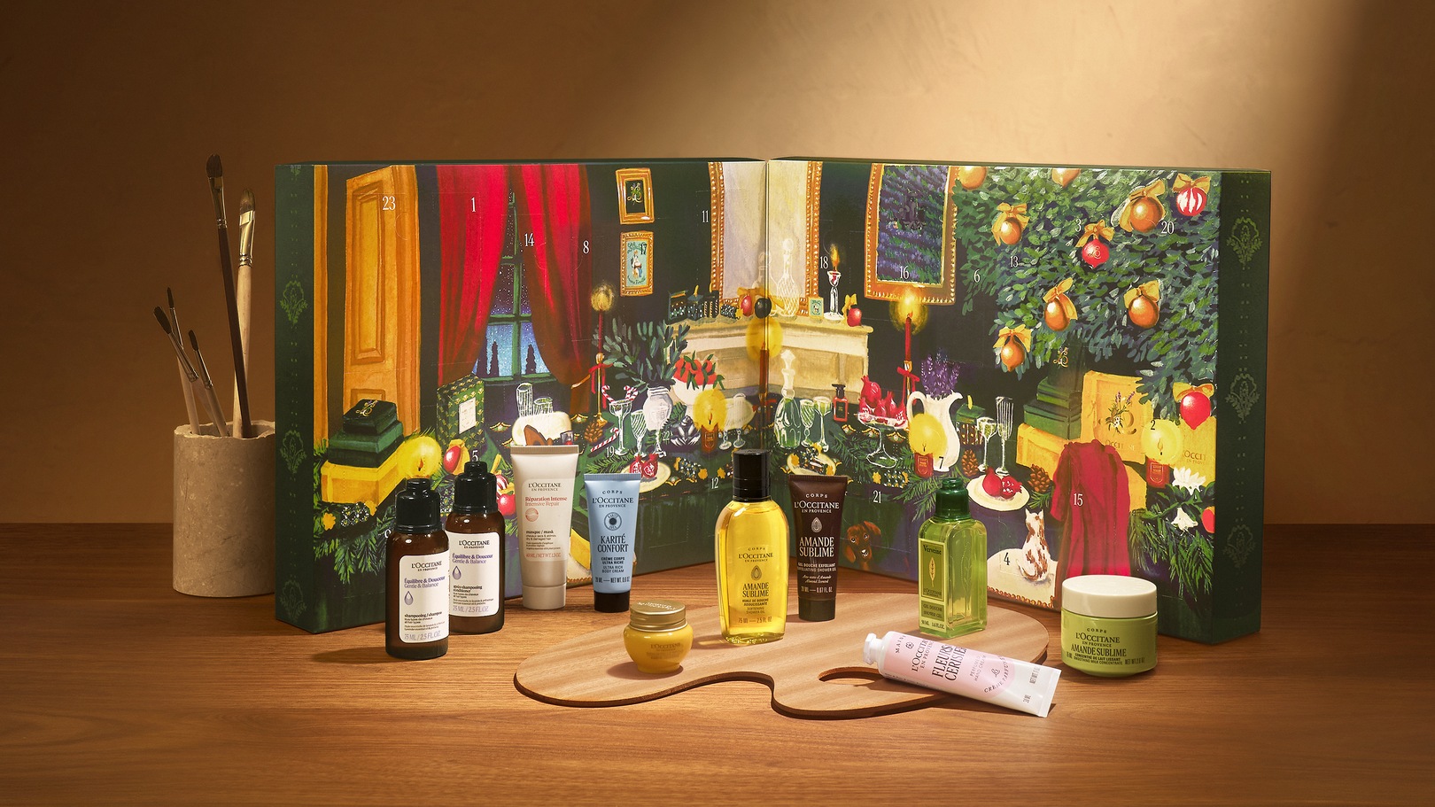 L'Occitane 2026 Classic Advent Calendar open on a wooden table with miniature beauty products