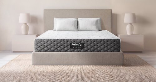 Puffy Cloud mattress with white pillows in a bright, neutral bedroom
