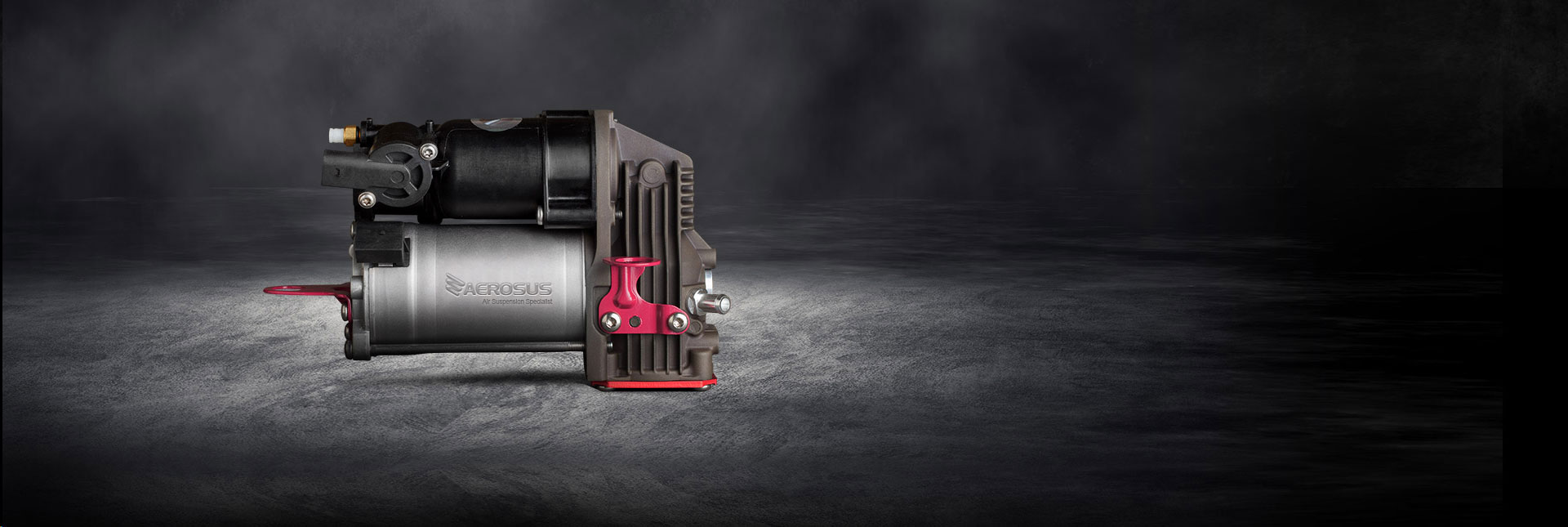 Air suspension compressor from Aerosus on a dark background