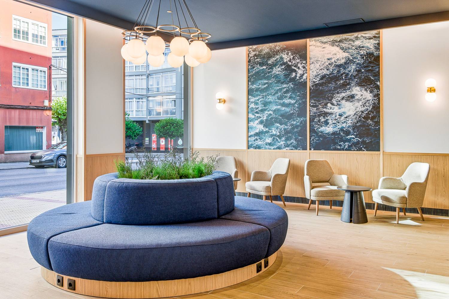 Bright modern lobby and lounge area at a B&B HOTELS property in Spain