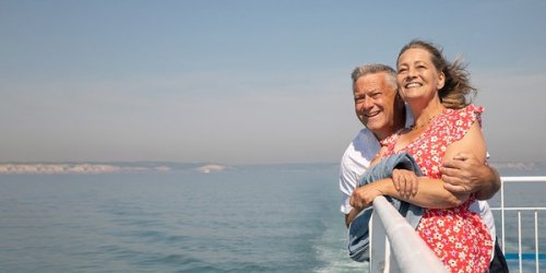 A couple standing at the rail on the deck of a DFDS ferry