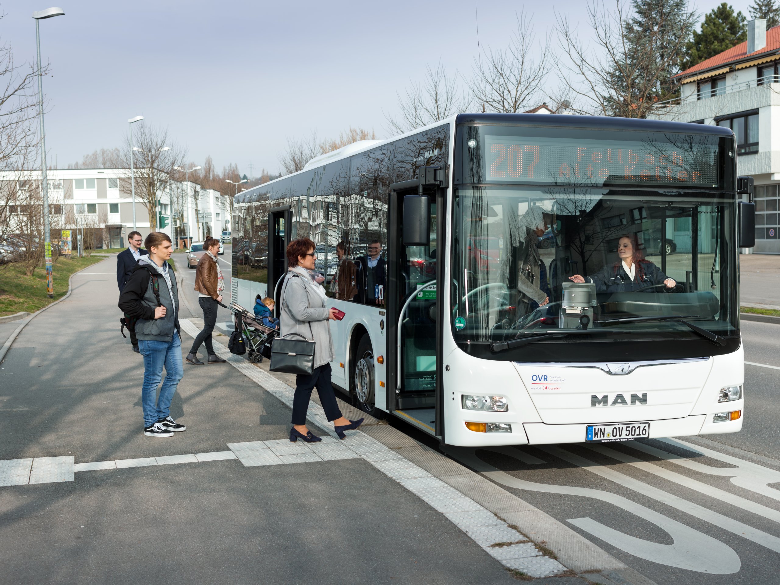 Passengers boarding a local bus with the Deutschlandticket