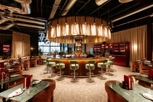 The bar and dining room at Songbird Restaurant and Bar inside Troubadour Canary Wharf Theatre