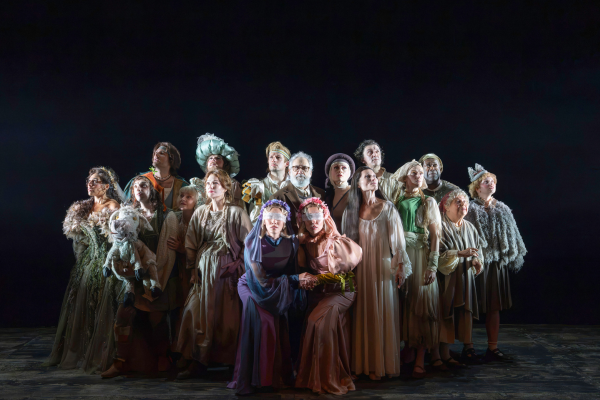 The full cast of Into the Woods gathered on stage in costume