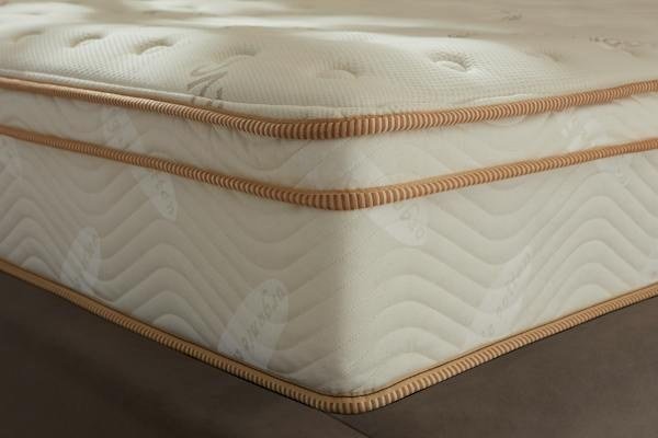 Close-up of the Saatva Classic Euro pillow top and corner stitching
