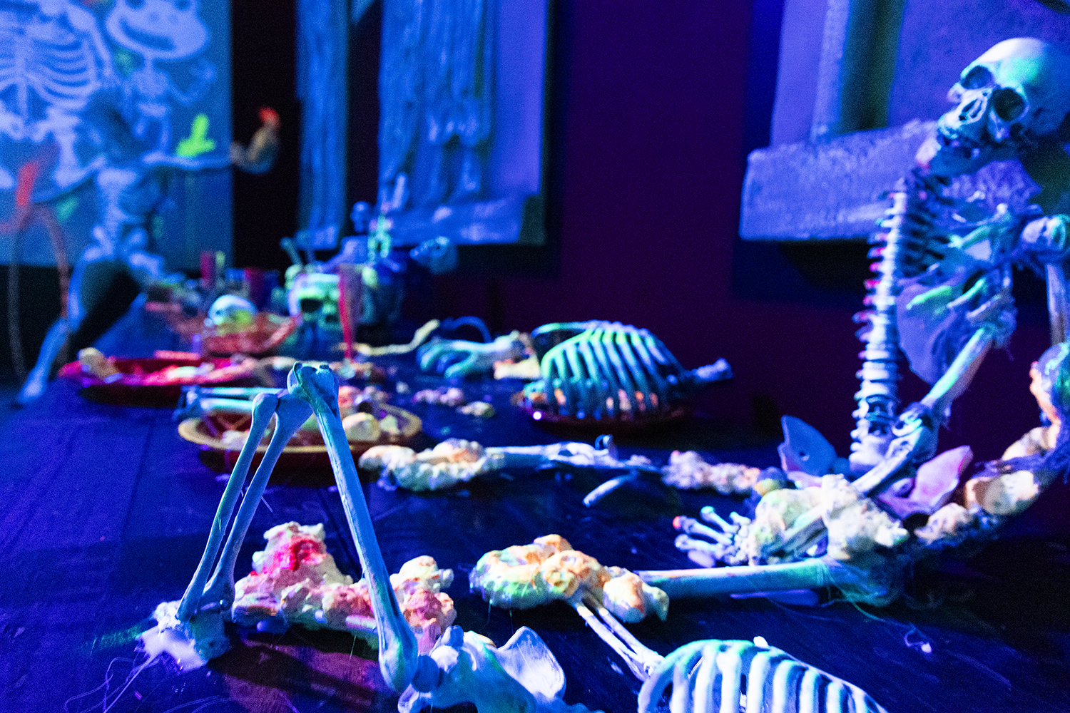 Skeletons and colourful offerings in a dramatic Halloween decoration at Terra Mítica
